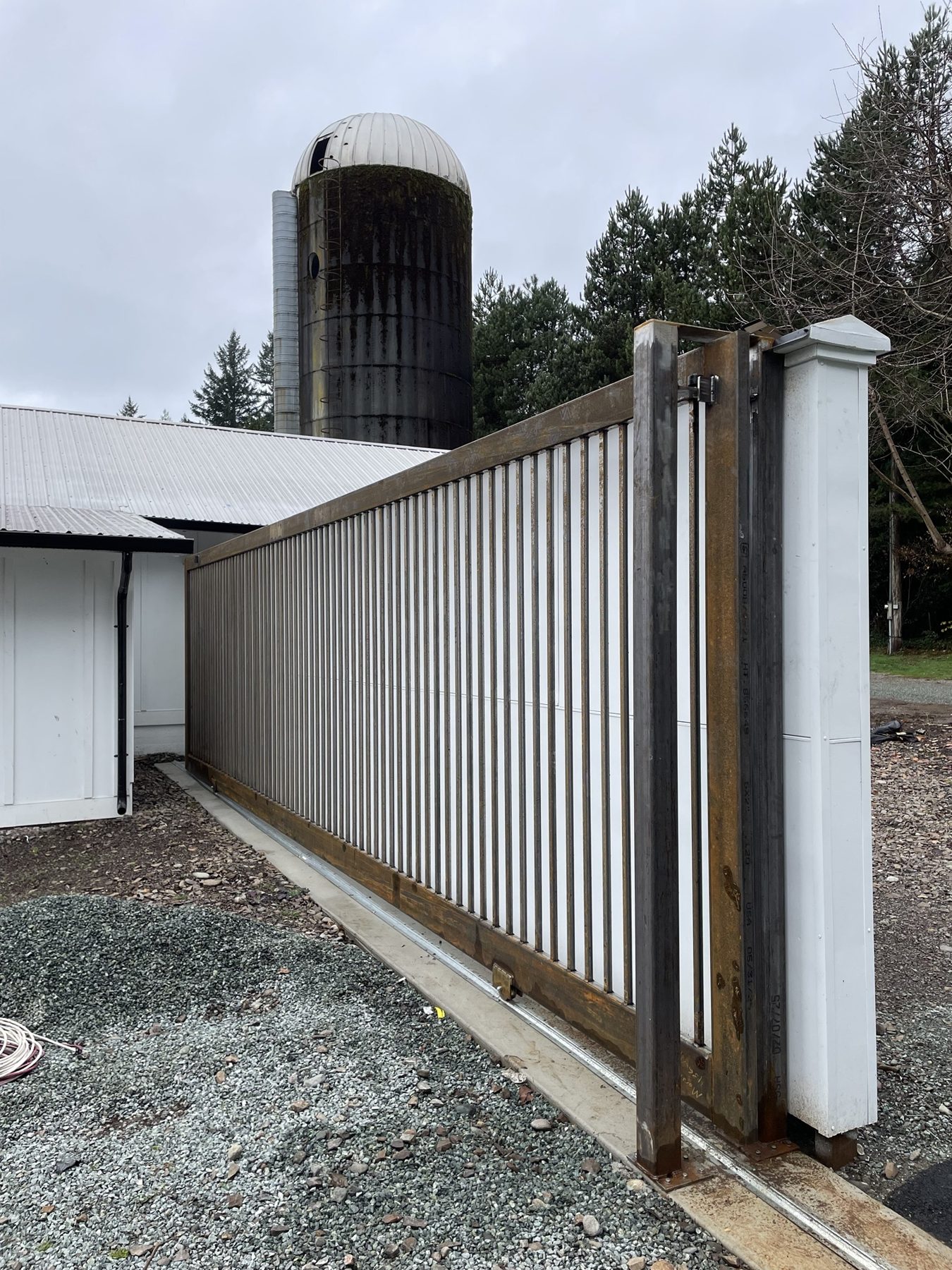 Sliding steel driveway gate